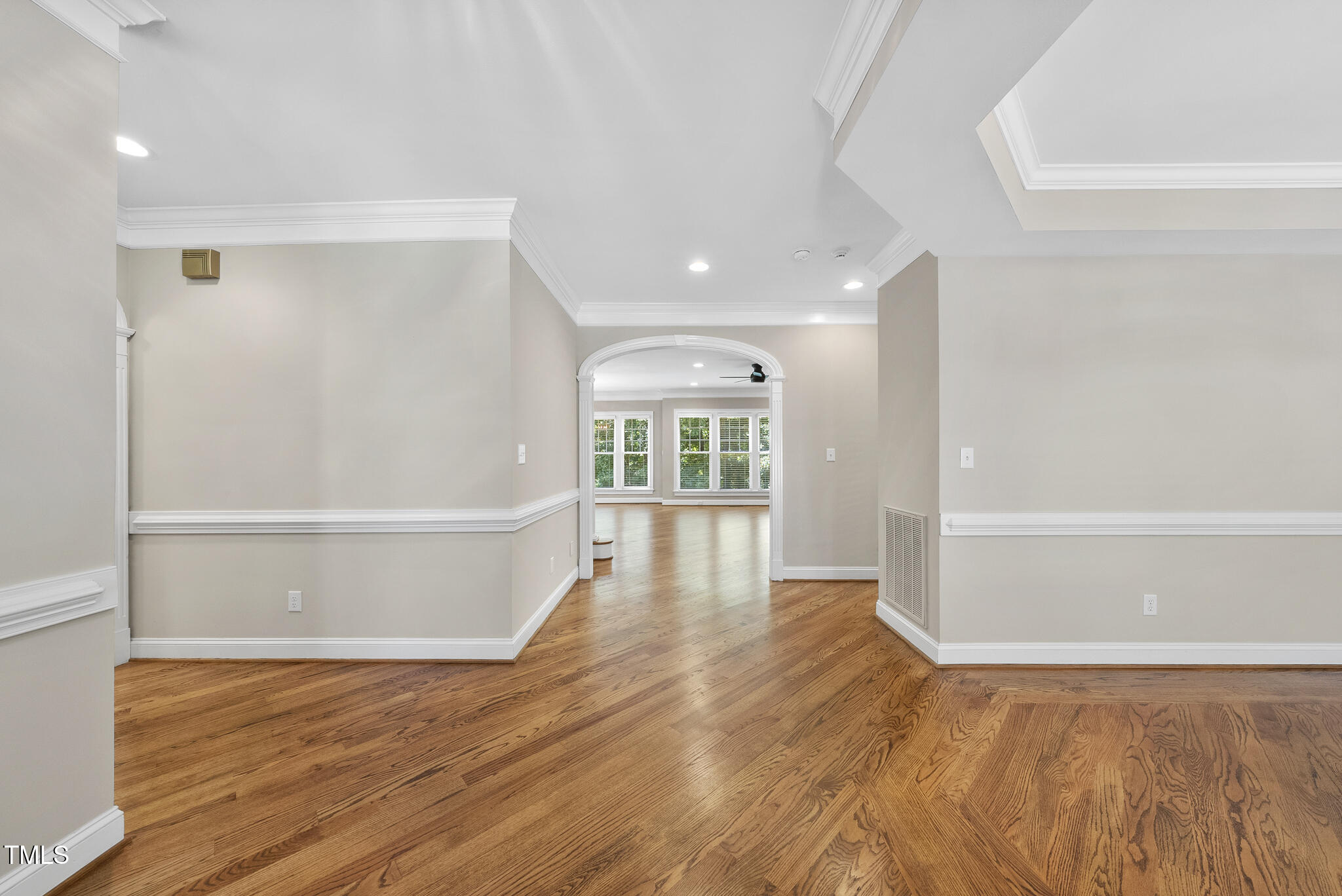 12257 Beestone Lane Raleigh, NC 27614 - Photo 6 of 59 a view of empty room with wooden floor and fan