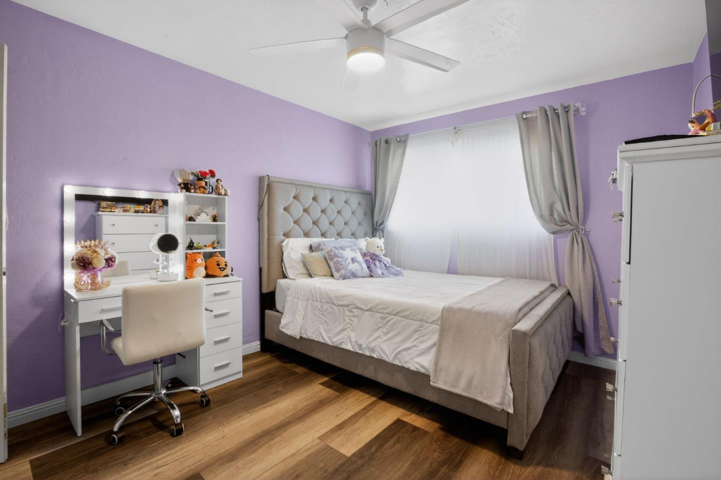 24 Amesti Road Watsonville, CA 95076 - Photo 17 of 27 a bedroom with a bed and a chandelier