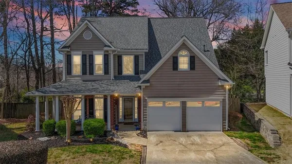 a front view of a house with garden