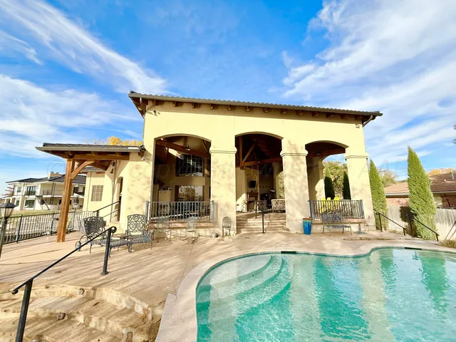 a view of swimming pool with outdoor seating
