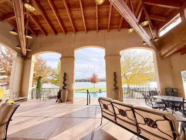 a view of living room with balcony and dining table