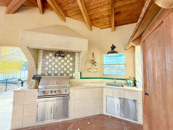 a view of yard with swimming pool and lake view