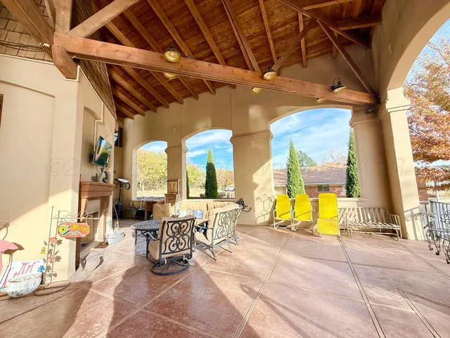 a view of a terrace with lake view and boat