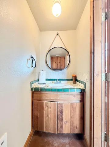 a view of a balcony with wooden floor and lake view