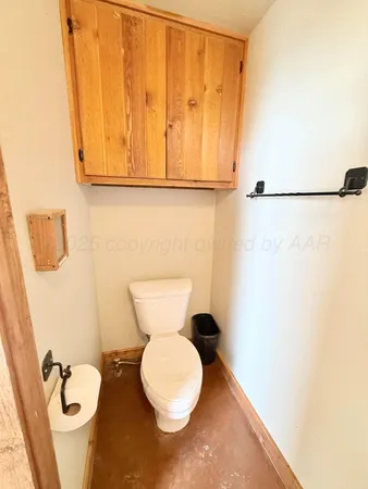 a living room with fireplace furniture and a chandelier