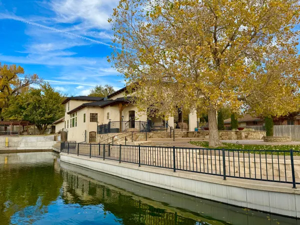 a kitchen with stainless steel appliances granite countertop a stove a sink and cabinets