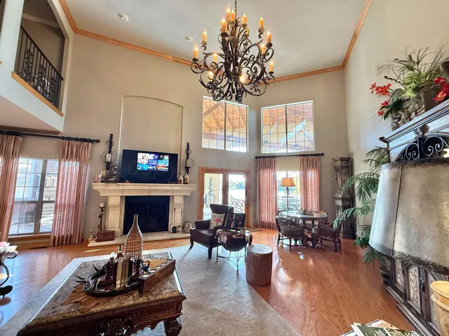 a spacious bedroom with a bed and lounge chair