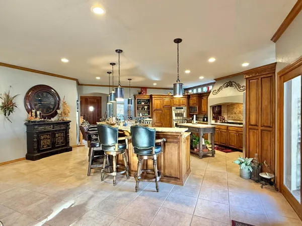 a bedroom with two beds and a chandelier