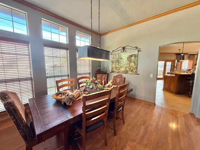 a living room with furniture and a ceiling fan