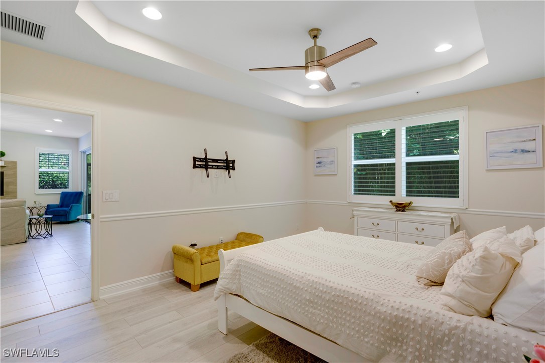 2343 Sheen Lane, Unit 401 Naples, FL 34120 - Photo 11 of 40 a bedroom with bed and window