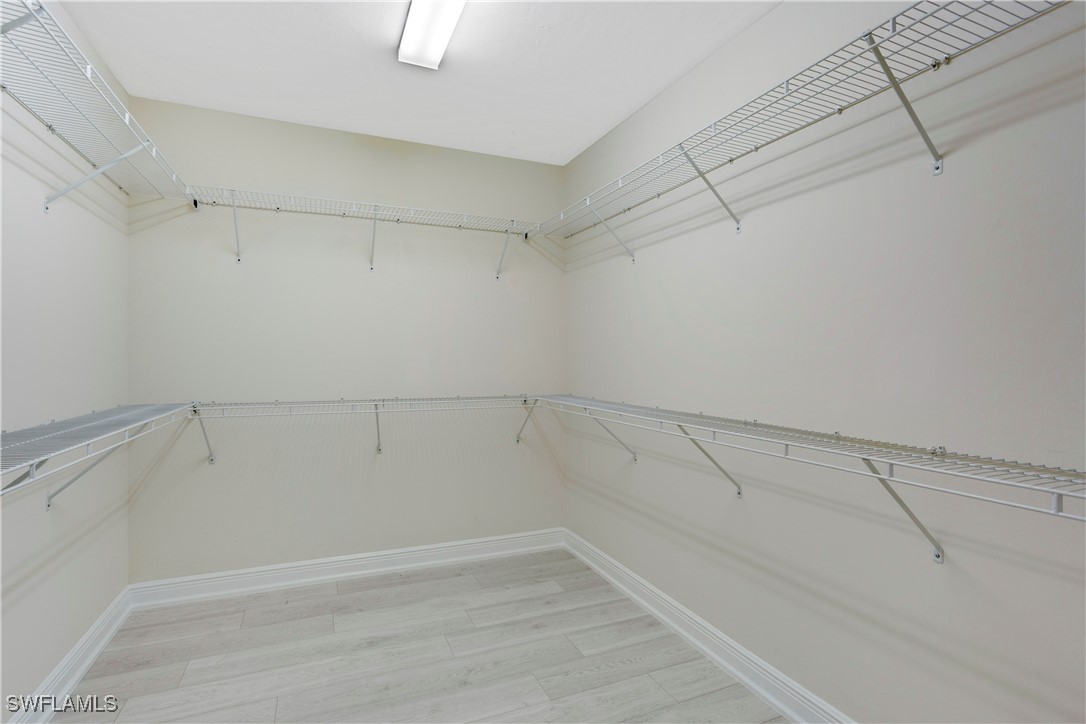 2343 Sheen Lane, Unit 401 Naples, FL 34120 - Photo 14 of 40 a view of a room with racks on the wall