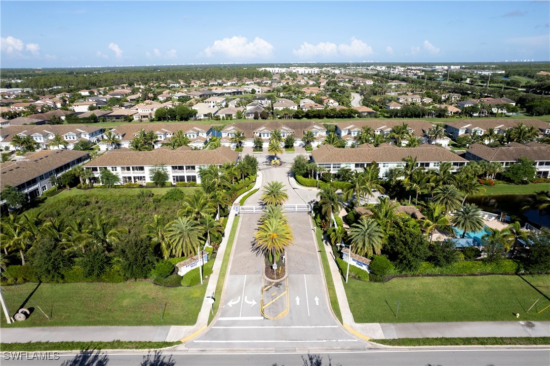 2343 Sheen Lane, Unit 401 Naples, FL 34120 - Photo 32 of 40 an aerial view of residential houses with outdoor space and street view