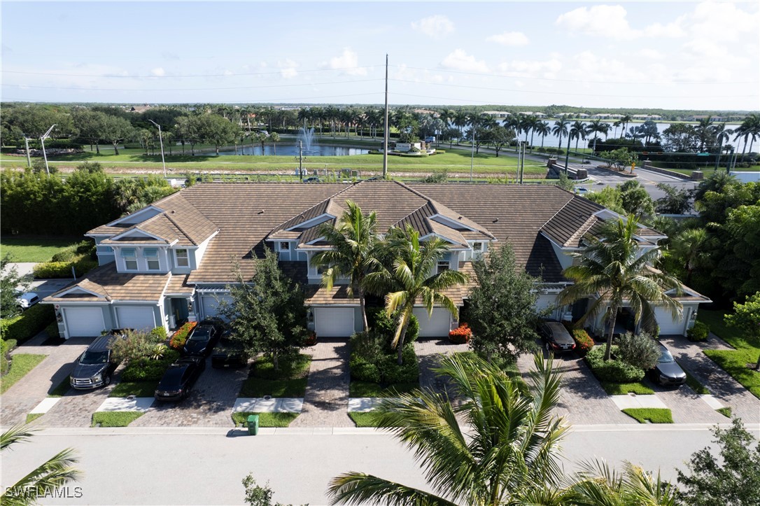 2343 Sheen Lane, Unit 401 Naples, FL 34120 - Photo 36 of 40 an aerial view of a house with outdoor space and lake view