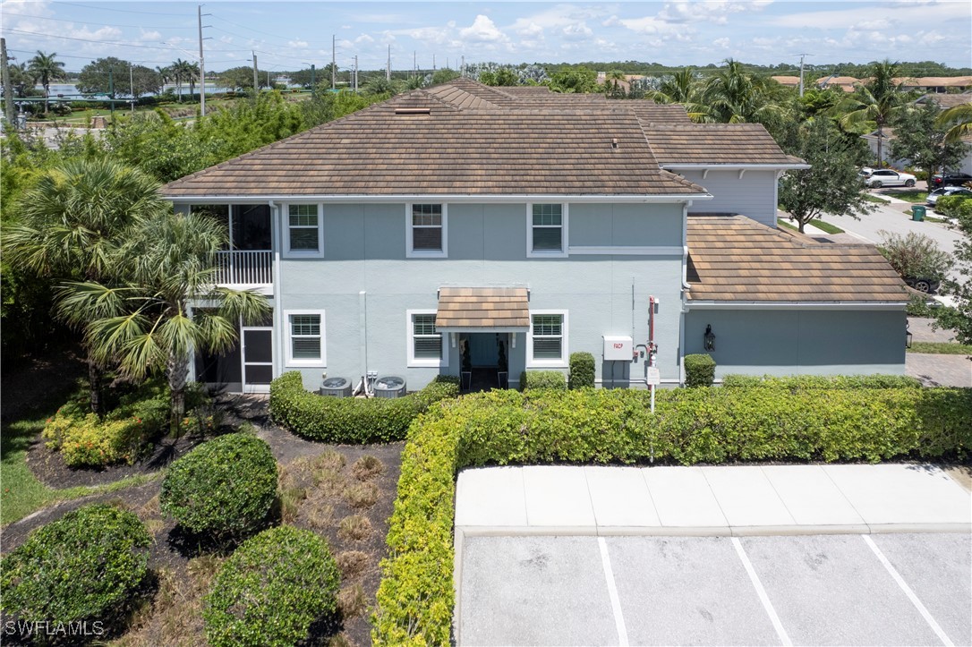 2343 Sheen Lane, Unit 401 Naples, FL 34120 - Photo 38 of 40 an aerial view of a house with a yard and potted plants