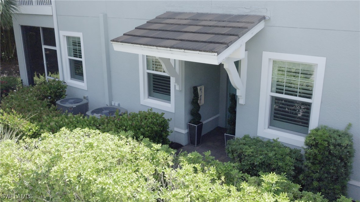 2343 Sheen Lane, Unit 401 Naples, FL 34120 - Photo 39 of 40 a view of outdoor space and garden view