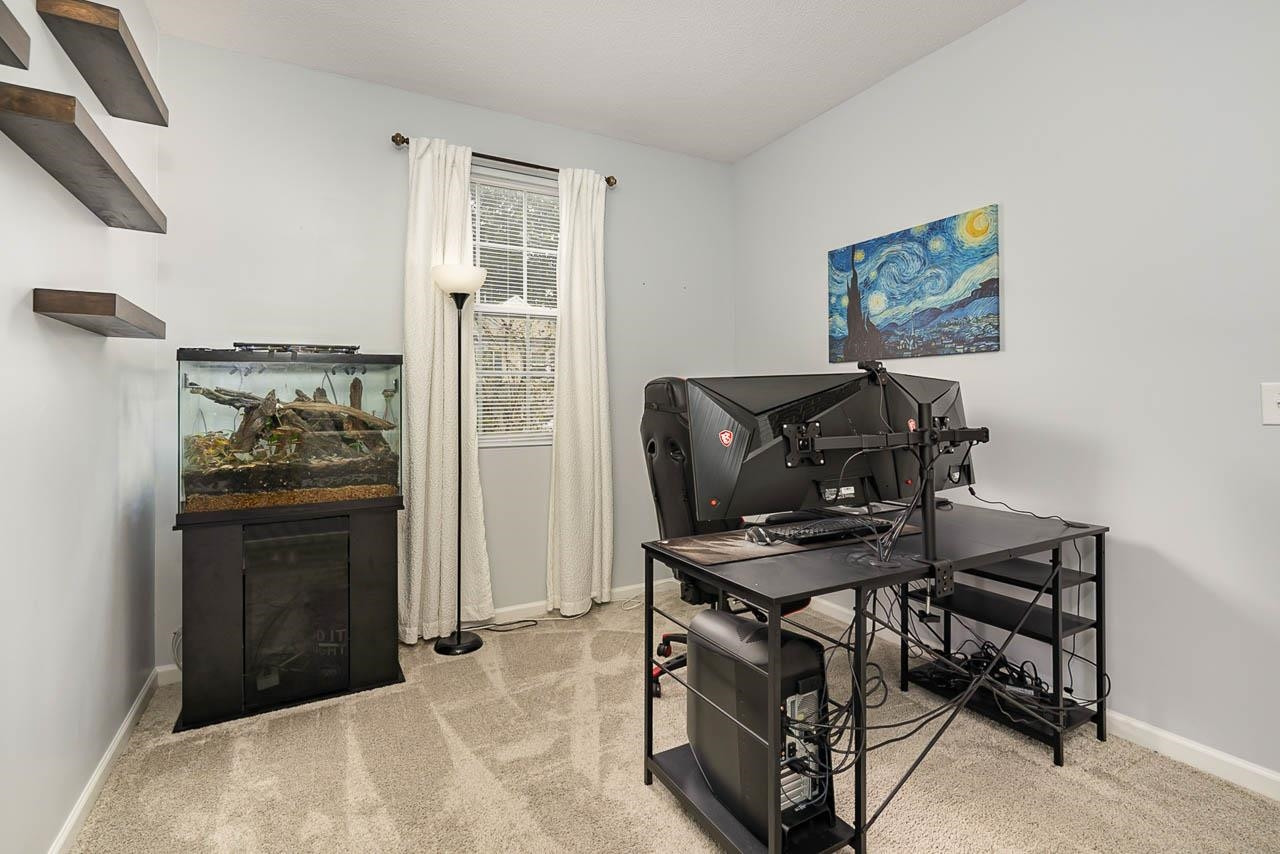 2458 Quarry Ridge Lane Raleigh, NC 27610 - Photo 14 of 15 First floor office for the remote worker! Floating shelves will convey! Studio/Study/Office