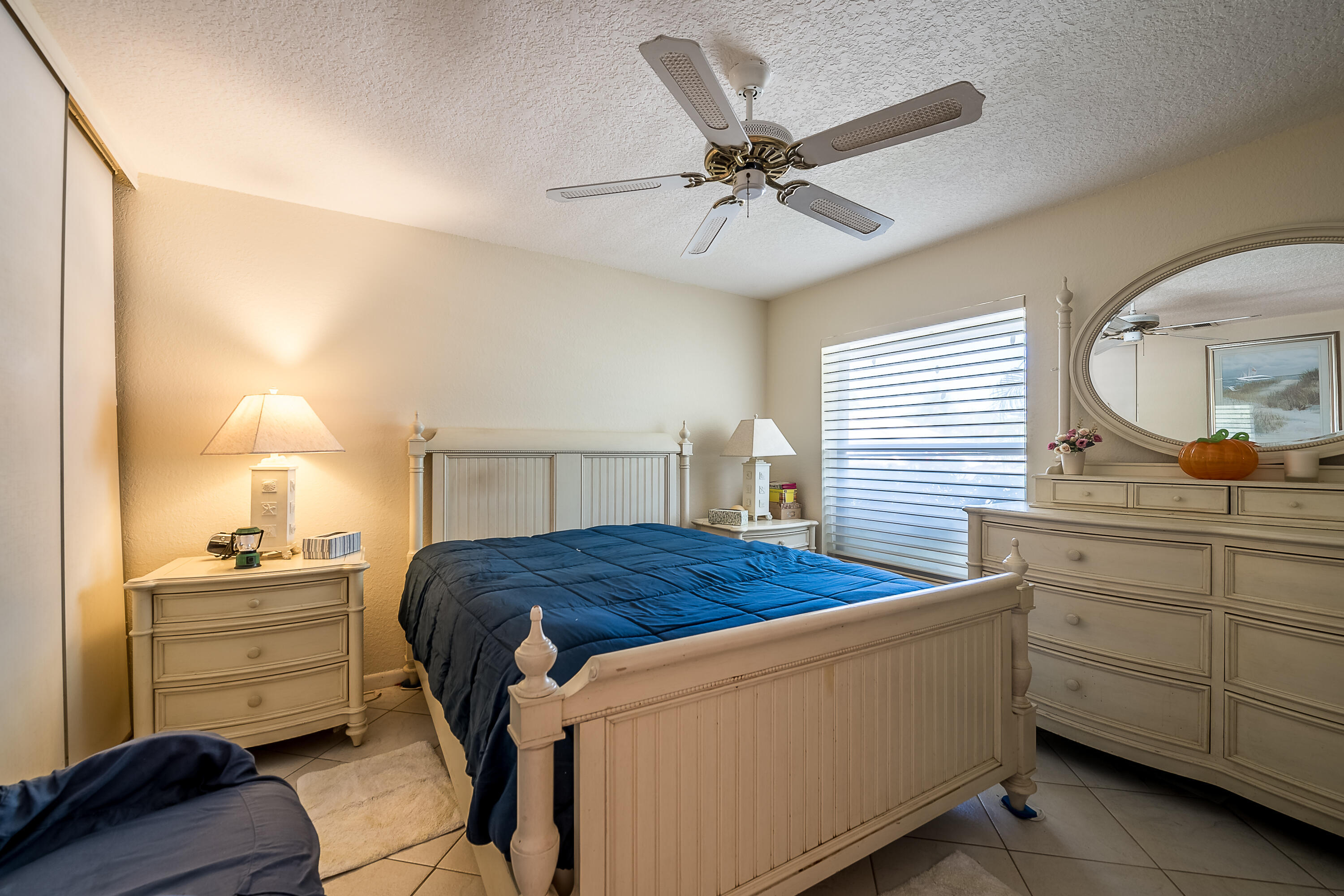 8440 Boca Glades Boulevard East Boca Raton, FL 33434 - Photo 11 of 16 a bedroom with a bed and a dresser