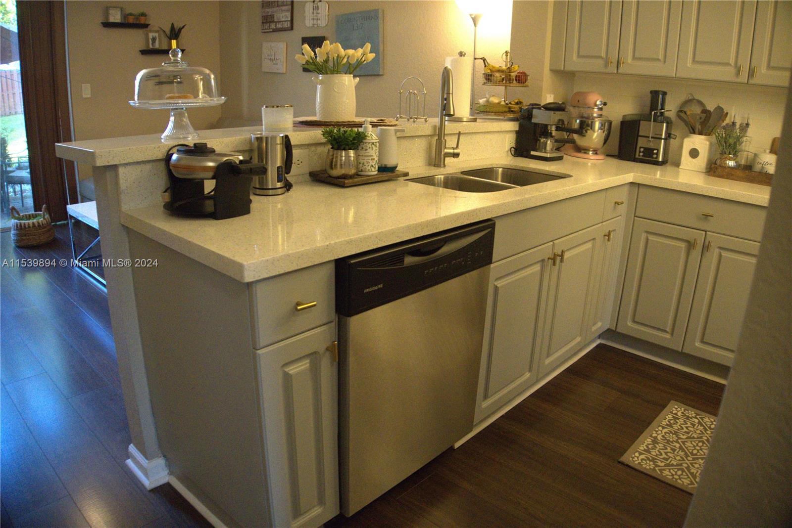 9143 Southwest 227th Street, Unit 3 Cutler Bay, FL 33190 - Photo 12 of 35 a kitchen with sink and cabinets