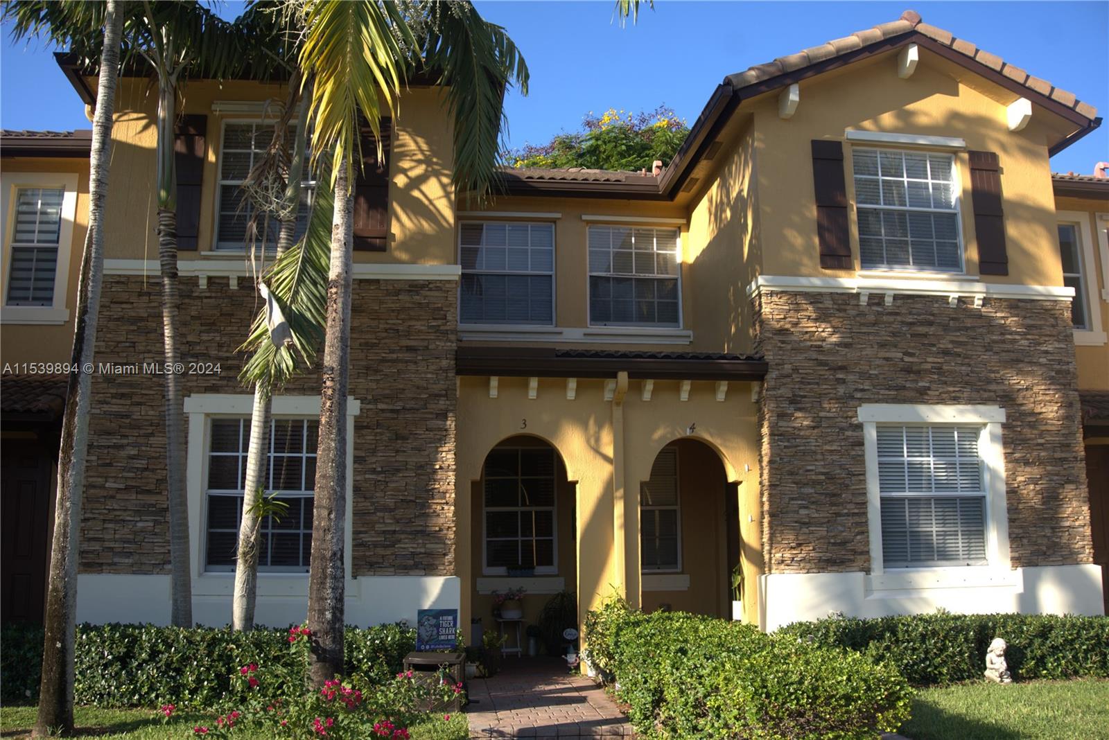 9143 Southwest 227th Street, Unit 3 Cutler Bay, FL 33190 - Photo 2 of 35 a front view of a house