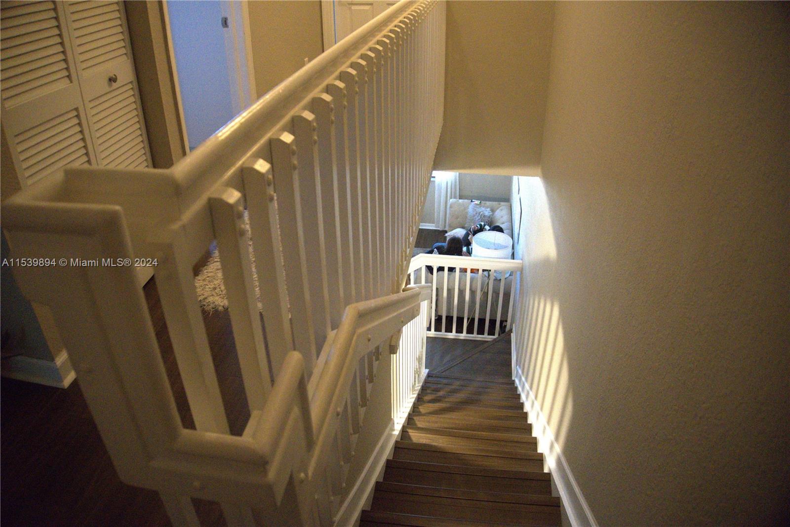 9143 Southwest 227th Street, Unit 3 Cutler Bay, FL 33190 - Photo 24 of 35 a view of a staircase