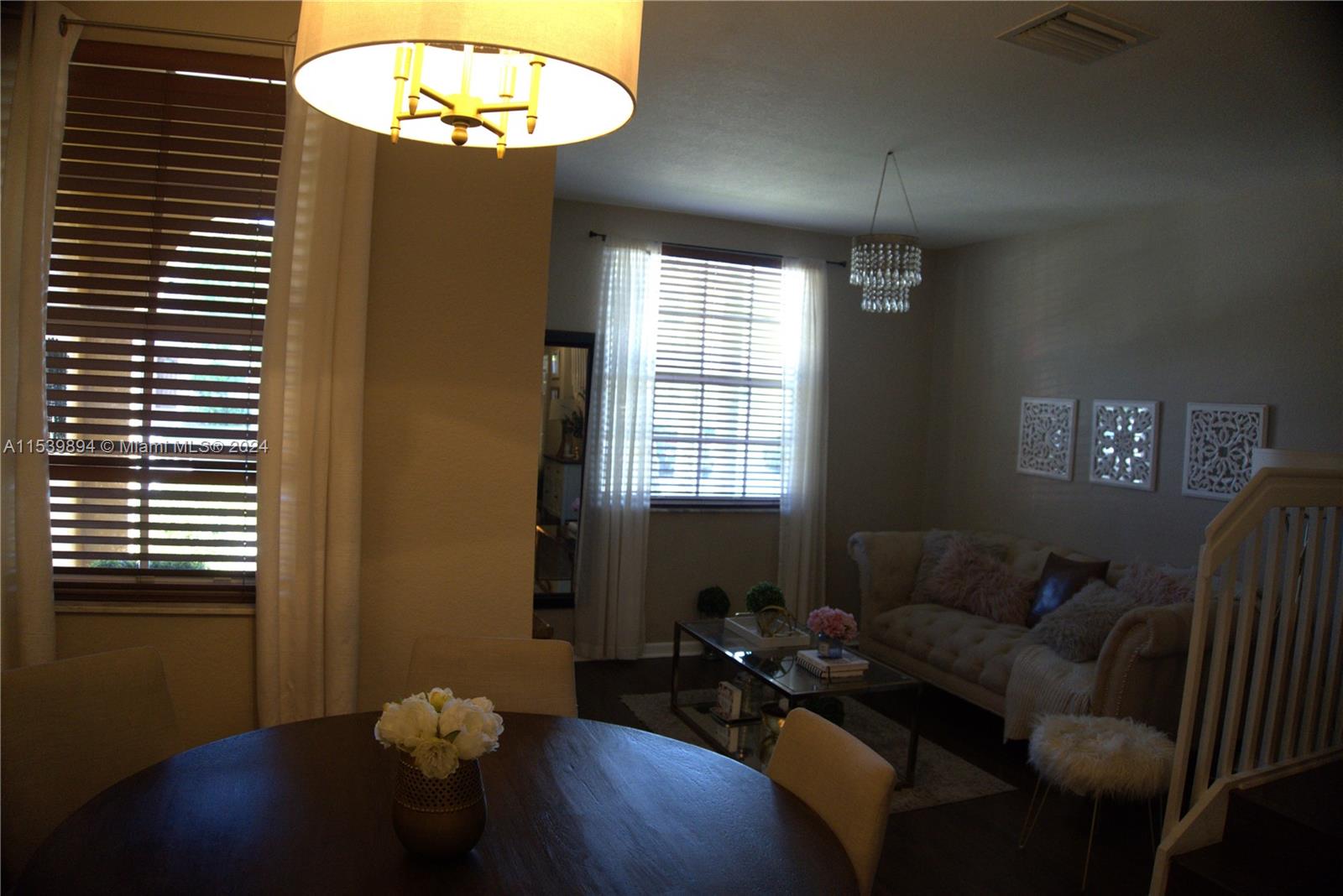 9143 Southwest 227th Street, Unit 3 Cutler Bay, FL 33190 - Photo 7 of 35 a living room with furniture and a window