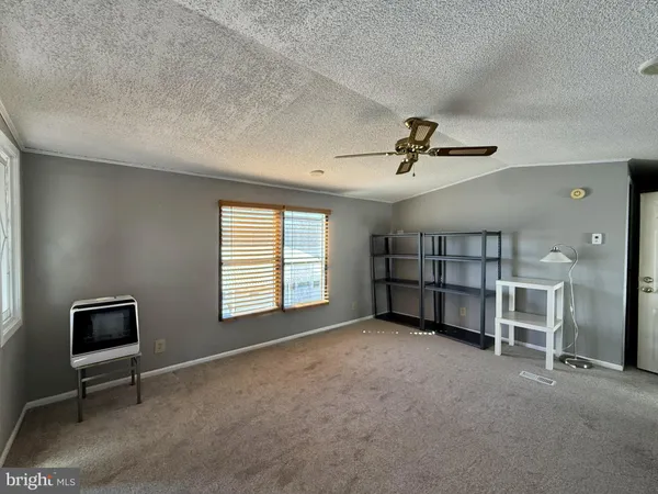 a view of a livingroom with a workspace