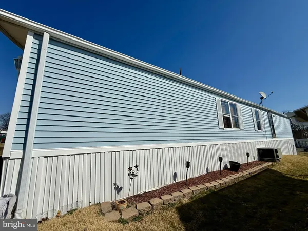 a view of wooden house with a large window