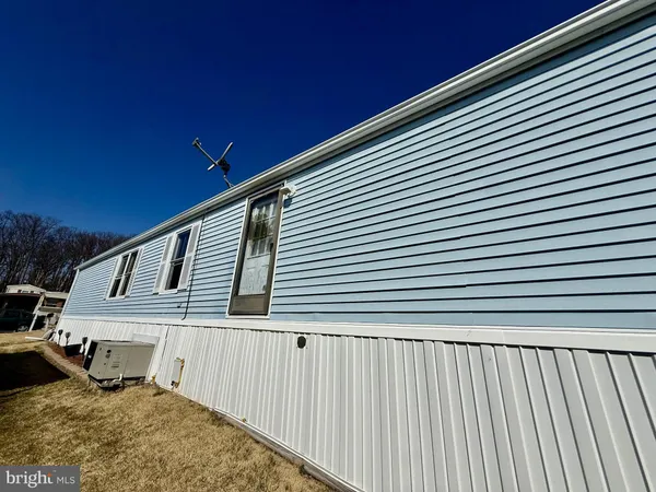 a front view of a house with two yard