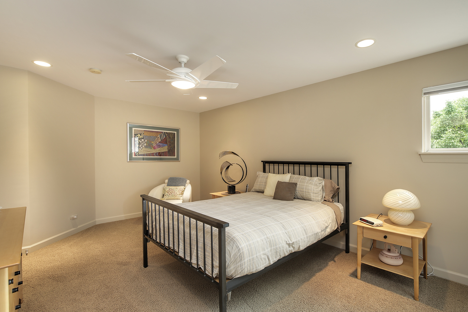 124 Ronan Road Highwood, IL 60040 - Photo 17 of 25 a bedroom with a bed and a chandelier