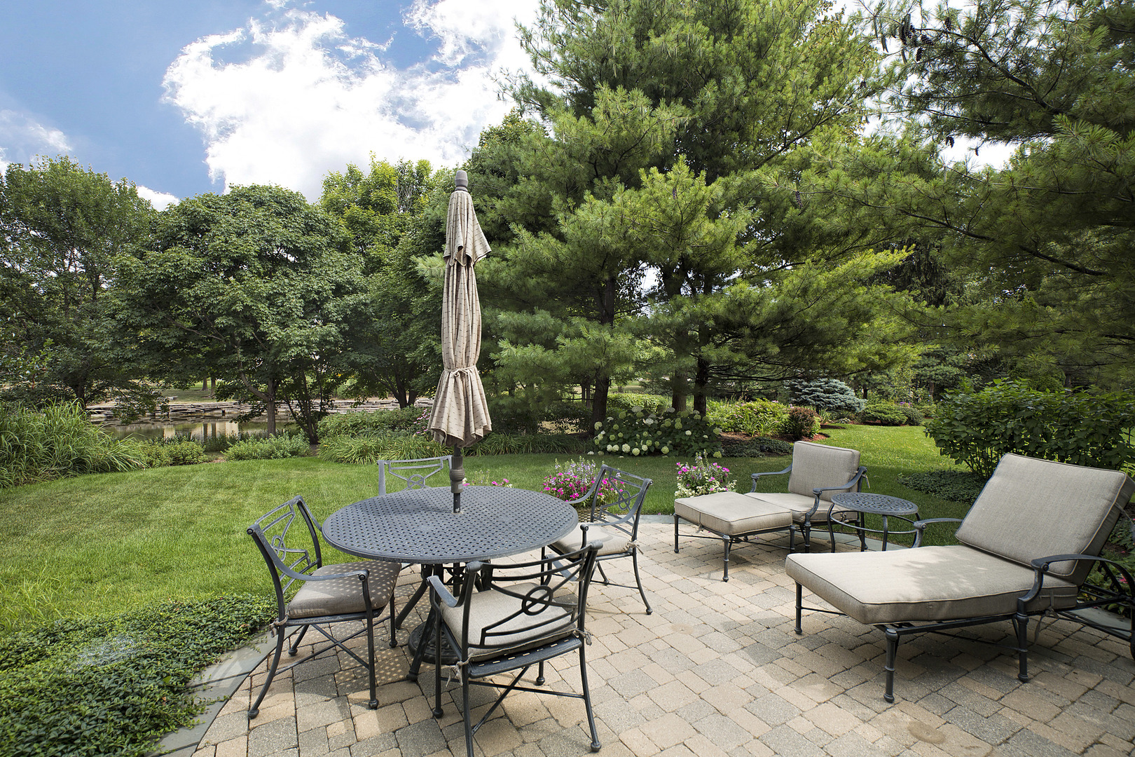 124 Ronan Road Highwood, IL 60040 - Photo 22 of 25 a view of a table and chairs in backyard of the house