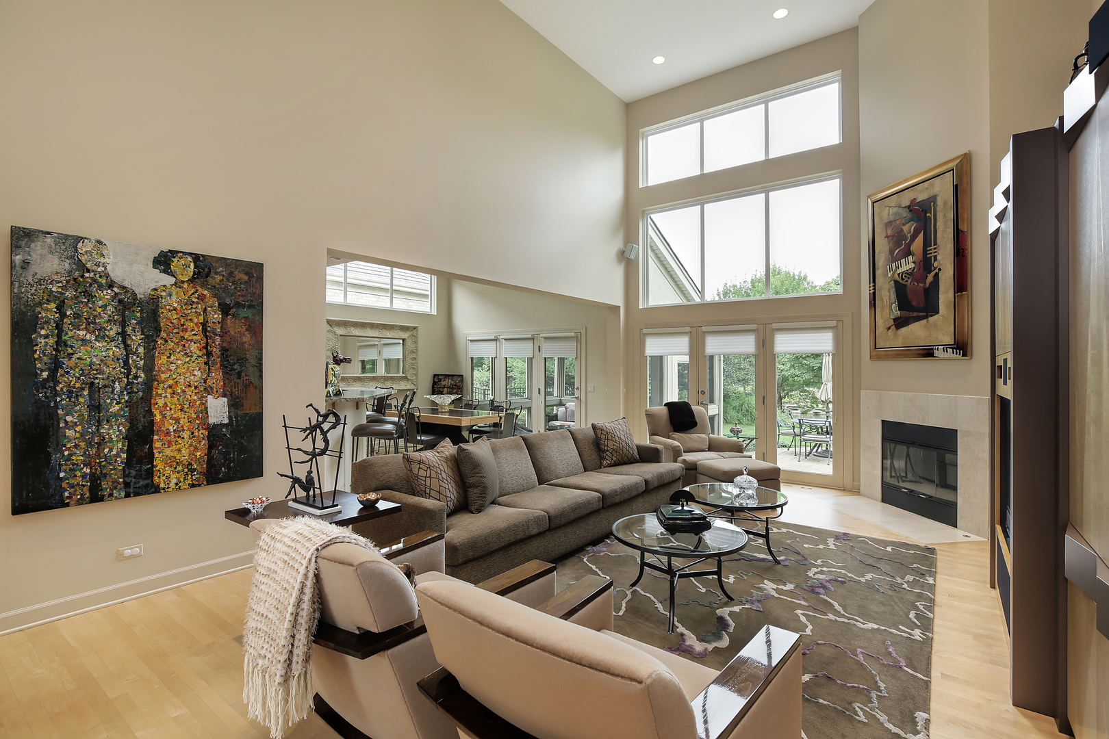 124 Ronan Road Highwood, IL 60040 - Photo 4 of 25 a living room with furniture a fireplace and a floor to ceiling window
