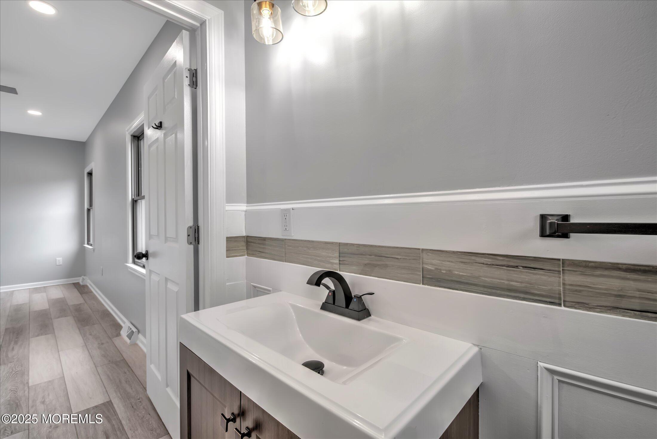 314 Motor Road Pine Beach, NJ 08741 - Photo 26 of 38 a bathroom with a sink and a mirror