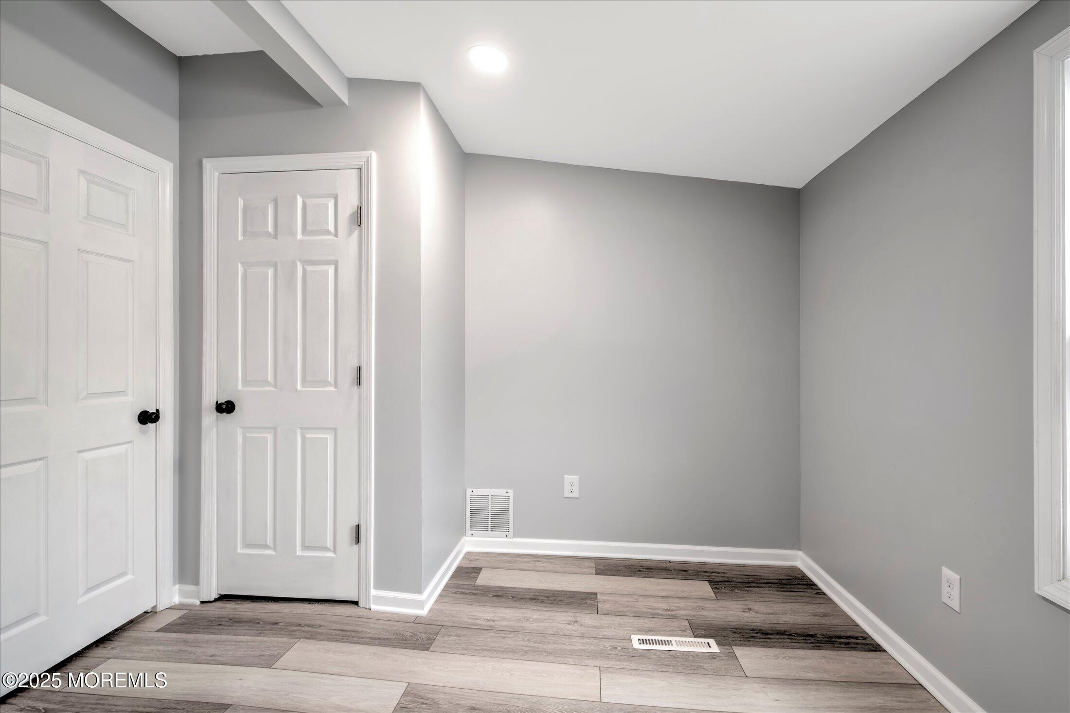 314 Motor Road Pine Beach, NJ 08741 - Photo 28 of 38 an empty room with wooden floor