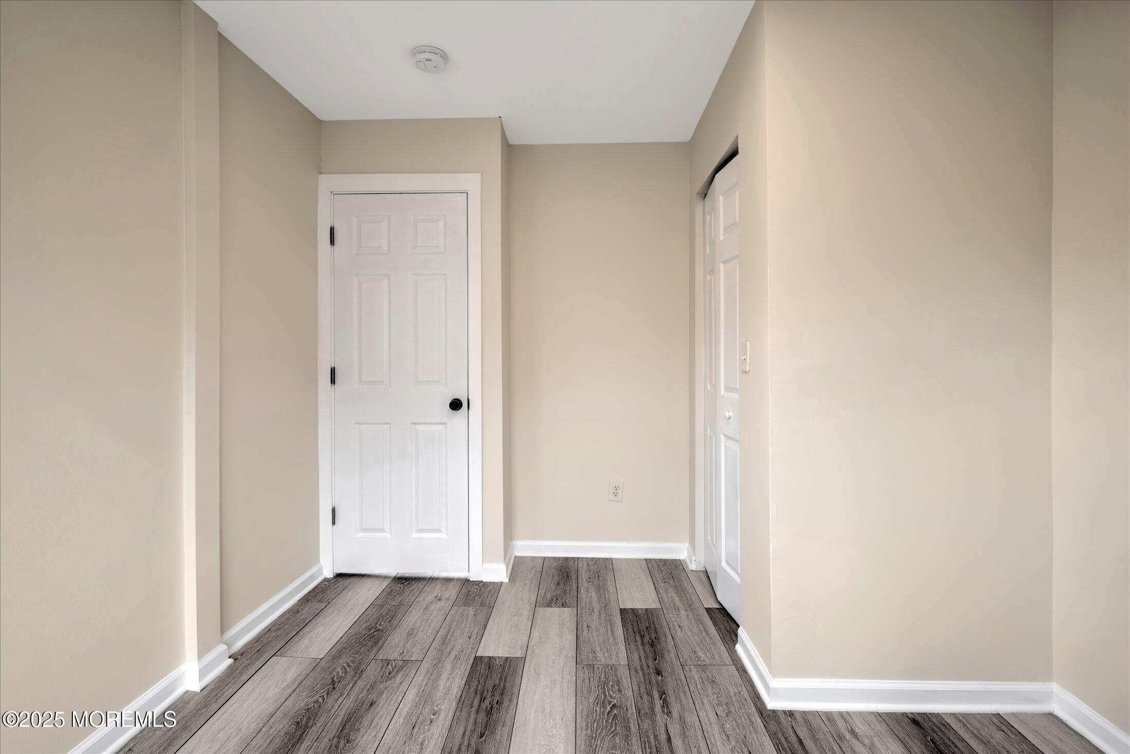 314 Motor Road Pine Beach, NJ 08741 - Photo 30 of 38 a view of a room with wooden floor and a gate