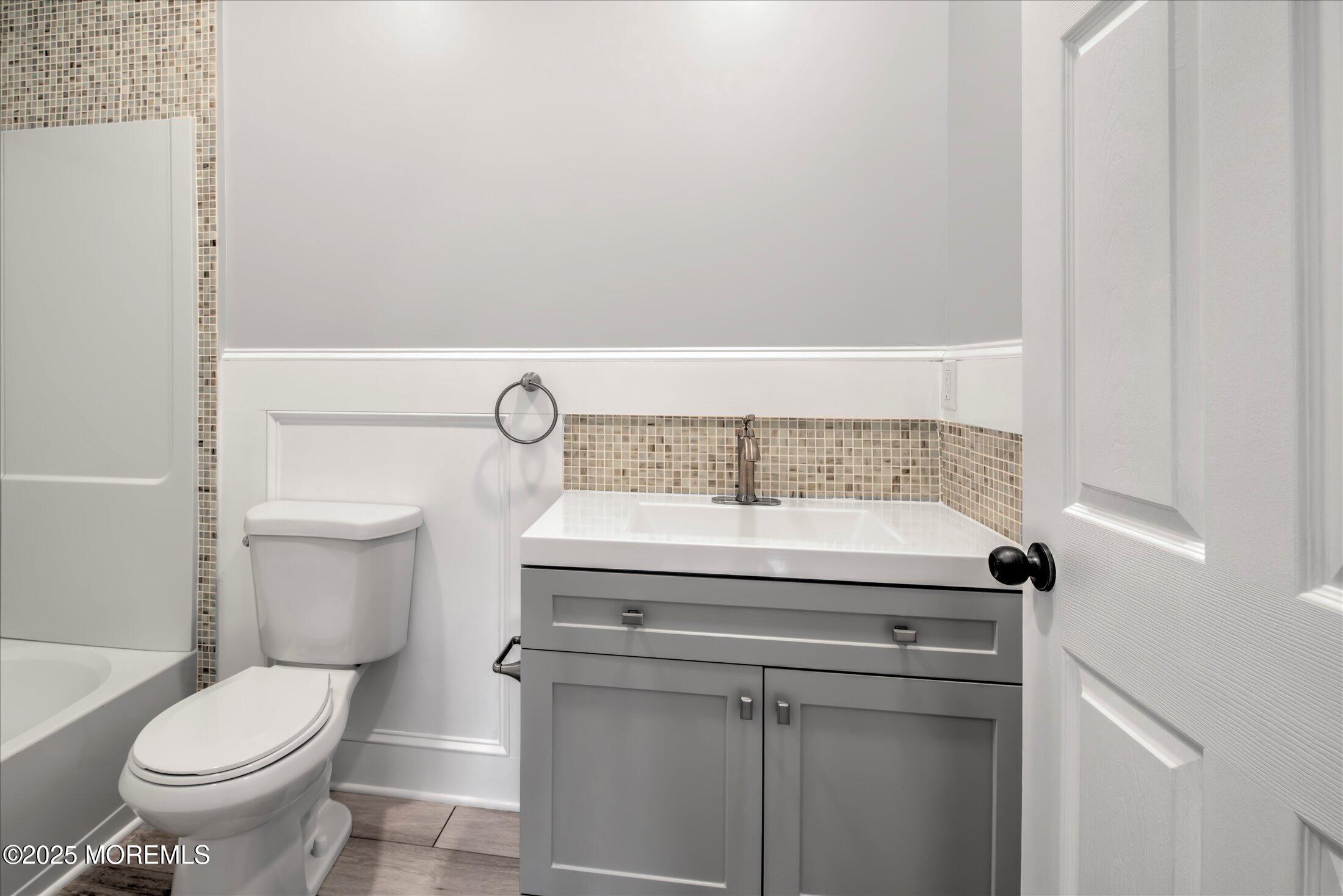 314 Motor Road Pine Beach, NJ 08741 - Photo 31 of 38 a bathroom with a granite countertop toilet and a sink