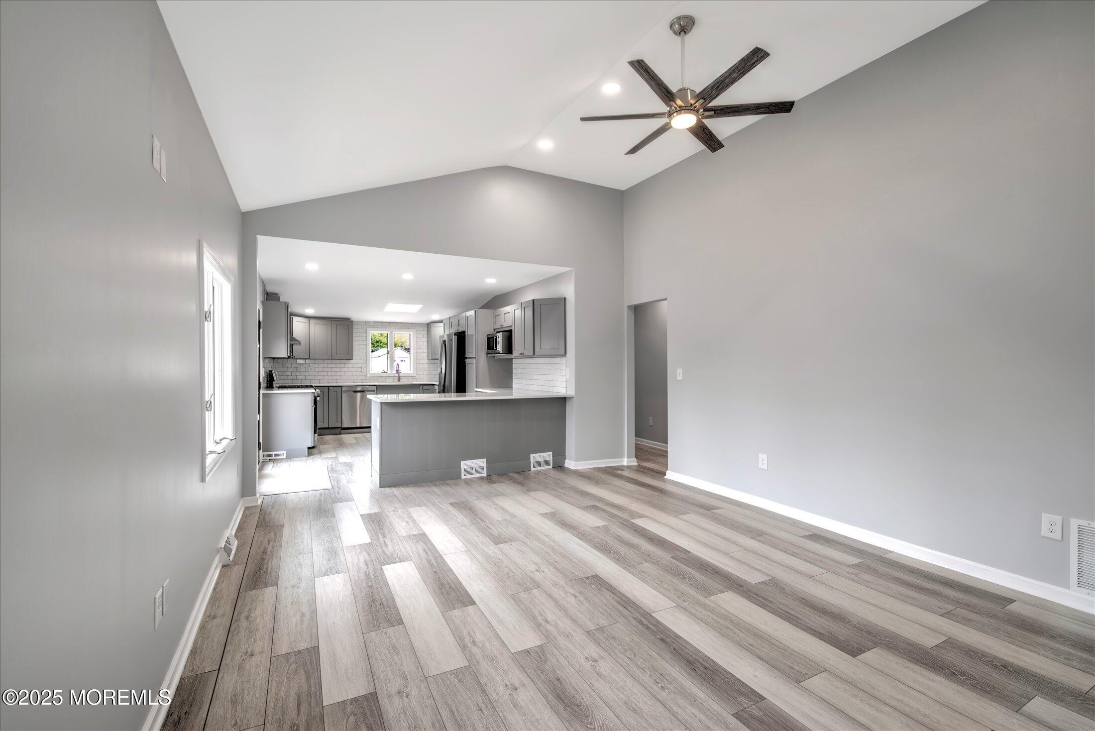 314 Motor Road Pine Beach, NJ 08741 - Photo 6 of 38 a view of a kitchen with a sink and a refrigerator