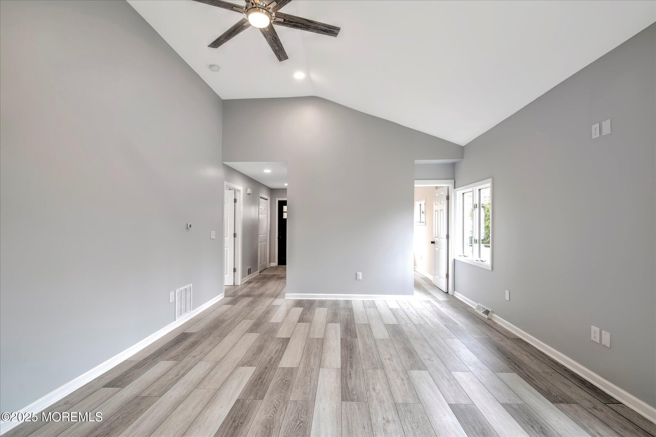 314 Motor Road Pine Beach, NJ 08741 - Photo 8 of 38 wooden floor in an empty room with a window