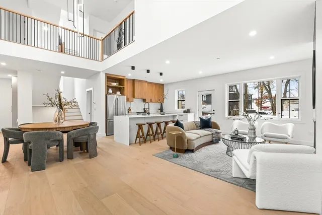 a dining room with furniture and wooden floor