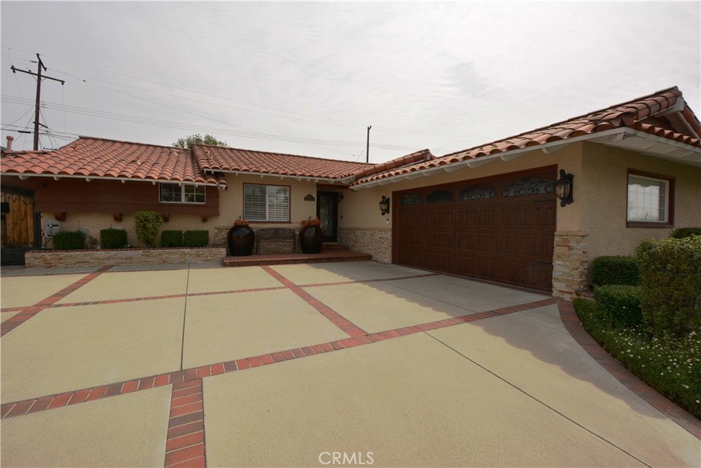 780 Ridgehaven Drive La Habra, CA 90631 - Photo 4 of 69 a front view of a house with a garage