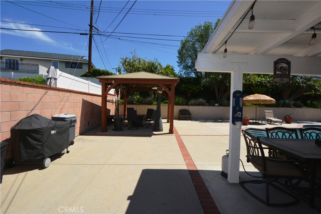 780 Ridgehaven Drive La Habra, CA 90631 - Photo 44 of 69 a view of a patio with table and chairs potted plants with wooden floor