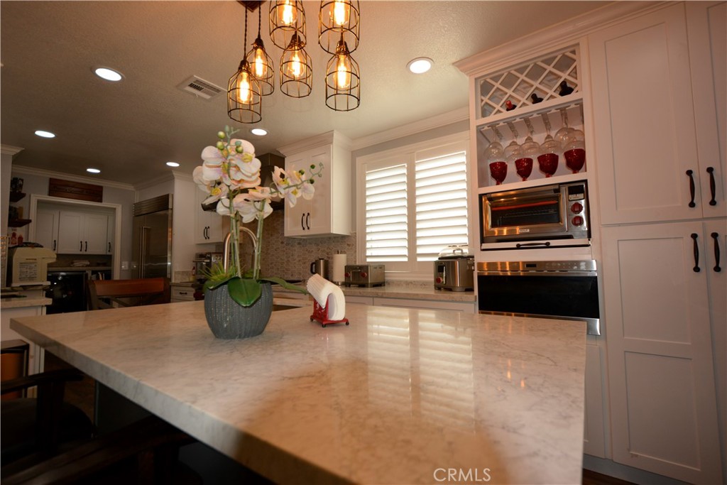 780 Ridgehaven Drive La Habra, CA 90631 - Photo 66 of 69 a view of a dining room and livingroom with furniture wooden floor a chandelier