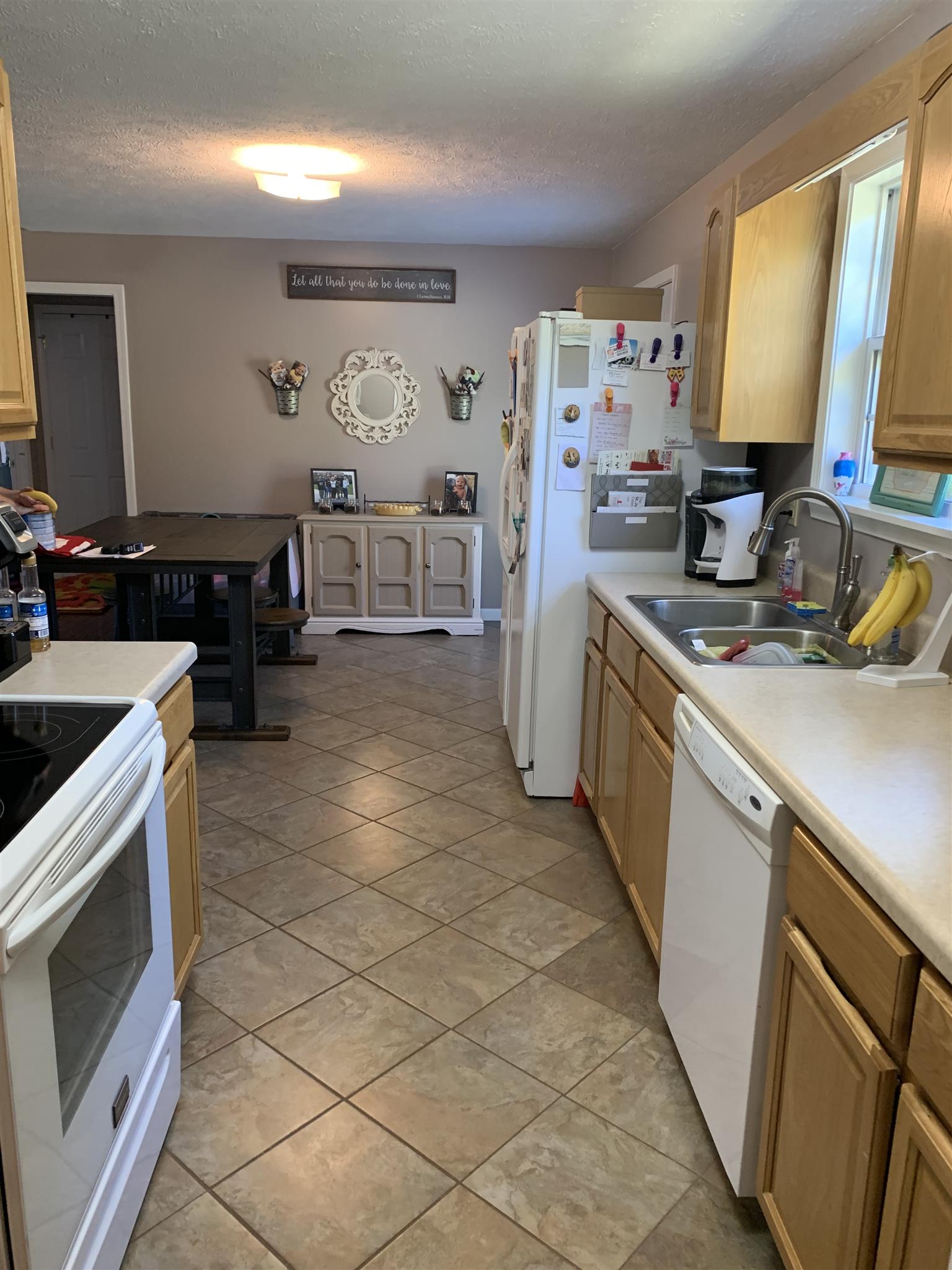 1225 Nelson Road Dickson, TN 37055 - Photo 11 of 18 a kitchen with a stove and a refrigerator