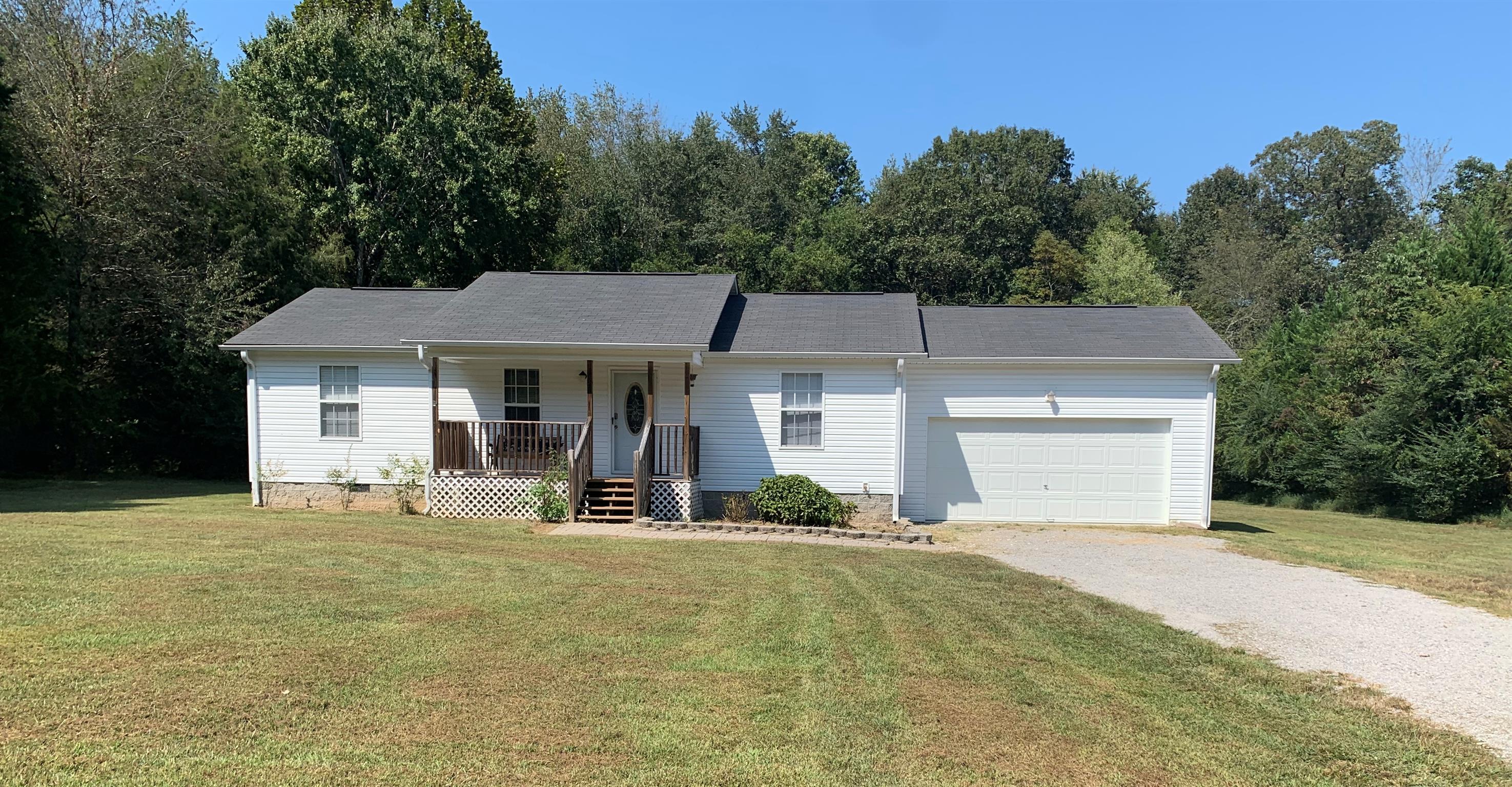 1225 Nelson Road Dickson, TN 37055 - Photo 18 of 18 a front view of a house with a yard