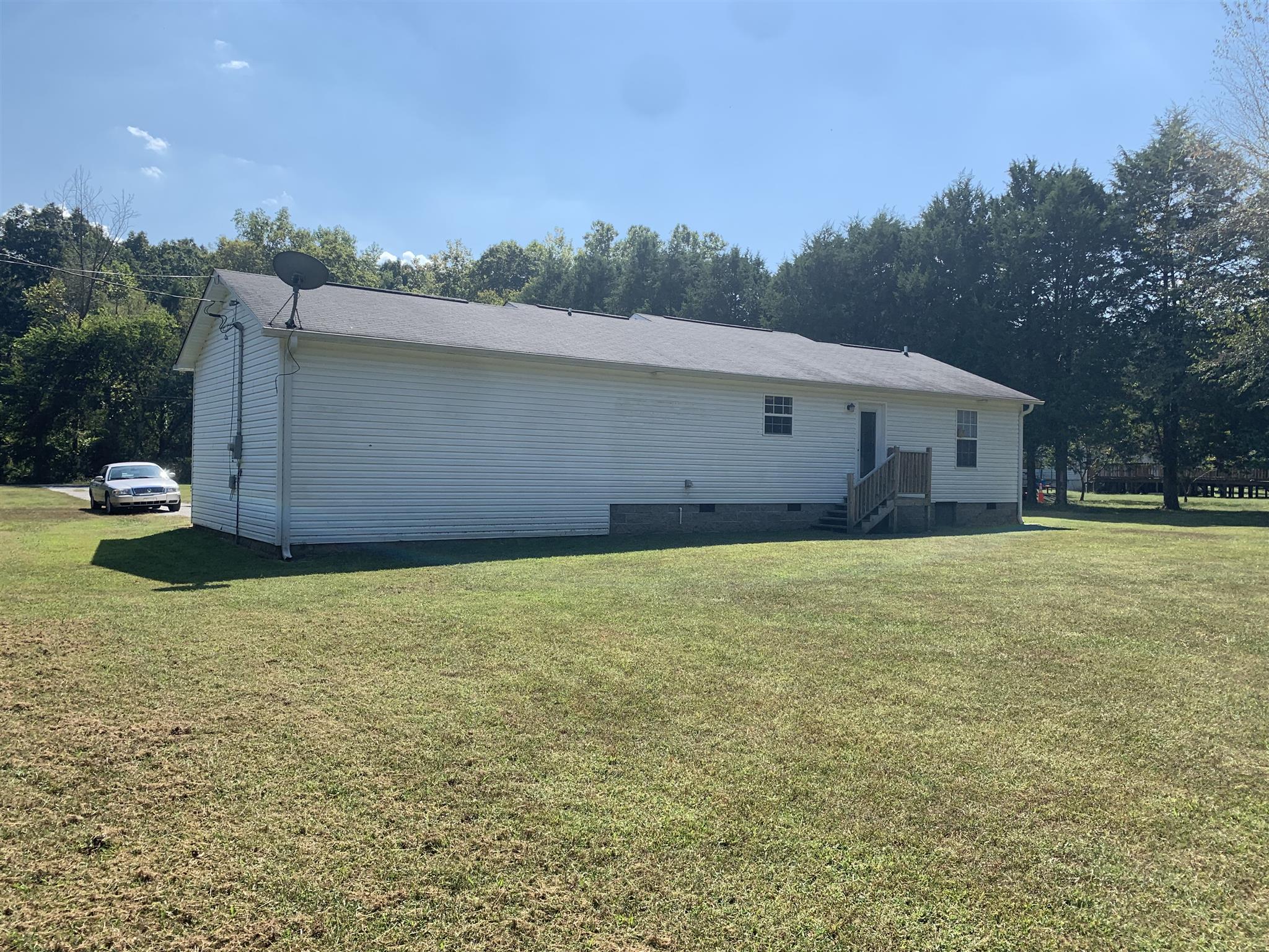 1225 Nelson Road Dickson, TN 37055 - Photo 2 of 18 a front view of a house with a yard