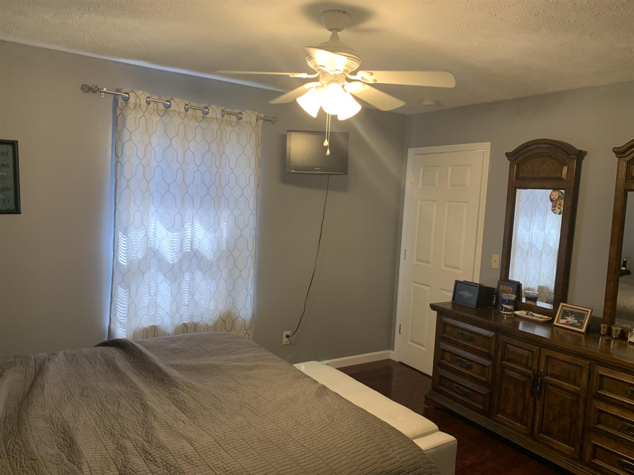 1225 Nelson Road Dickson, TN 37055 - Photo 7 of 18 a bedroom with a bed and a mirror