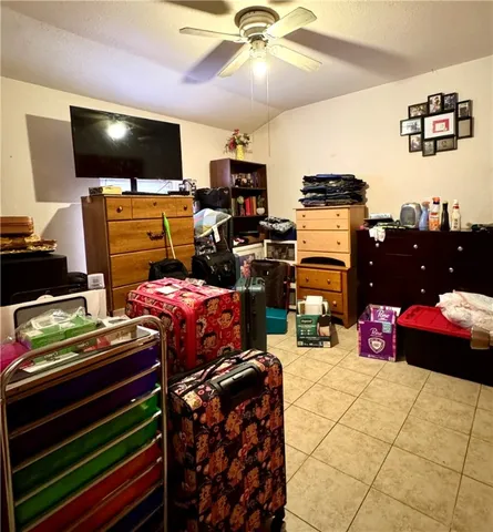 a bedroom with a bed and flat screen tv