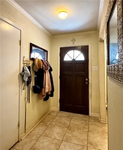 a view of a entryway door with a hallway