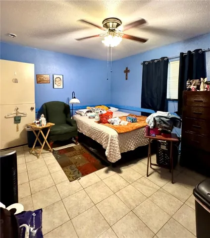 a bedroom with a bed and a table in it