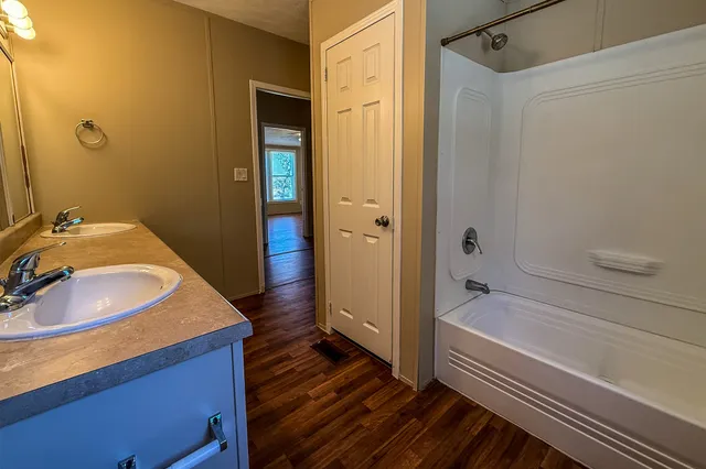 a bathroom with a sink and a shower