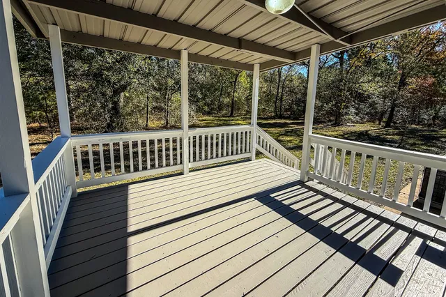 a view of balcony with wooden floor